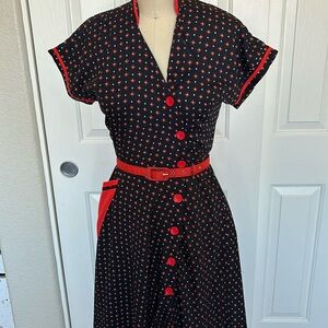 Navy and red print with buttons and pockets Tatiana 1940s inspired dress.